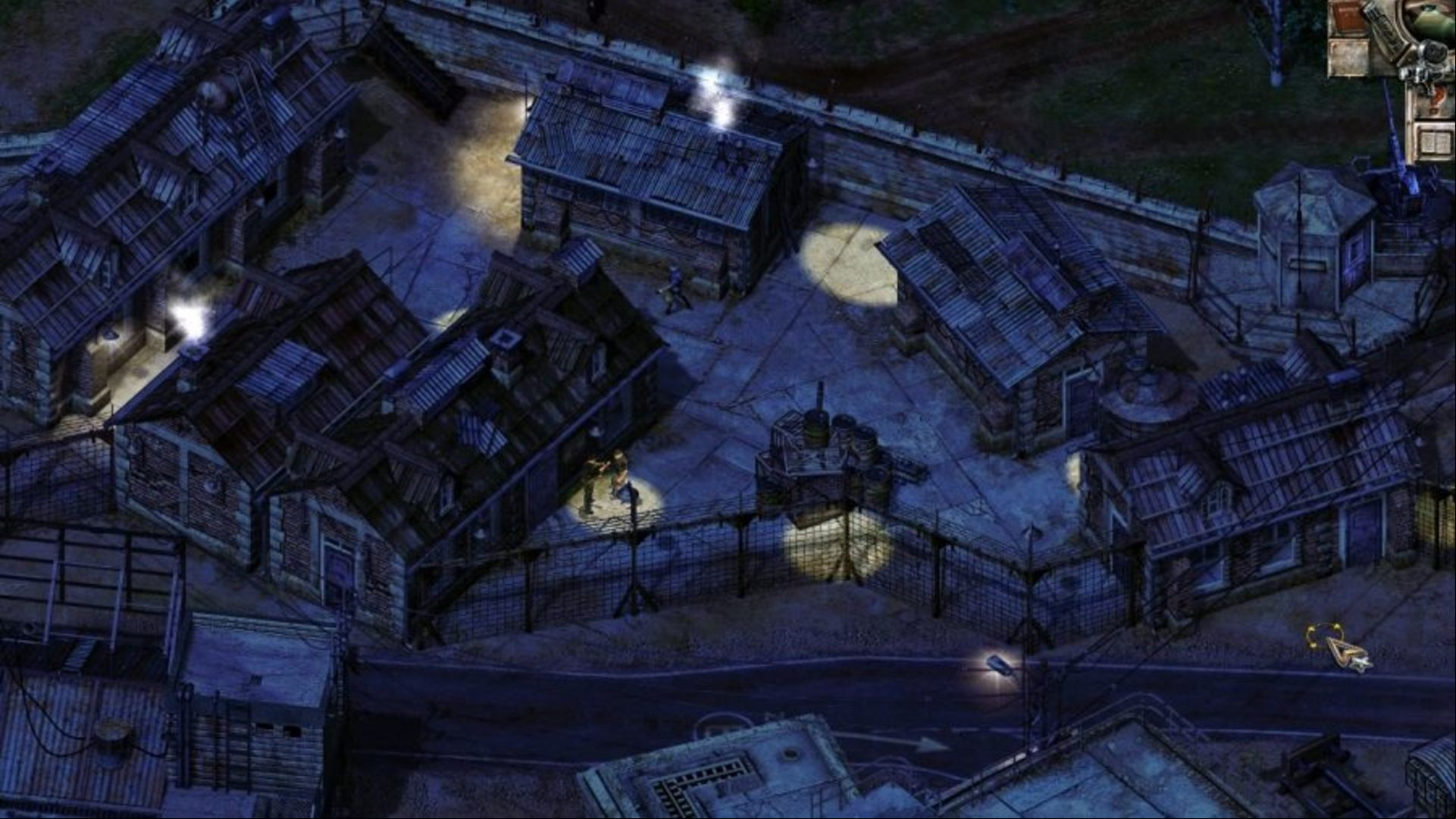 Best WW2 games: Commandos 2: Men of Courage. Image shows a military barracks a night.