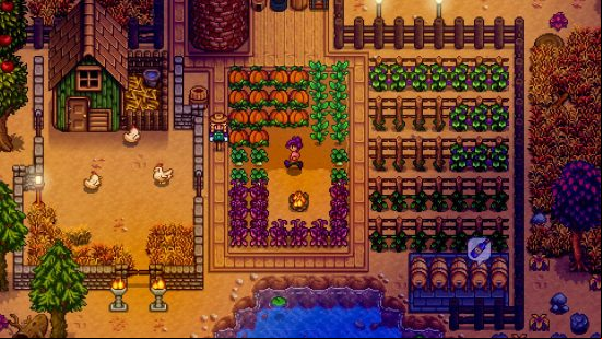 An autumnal looking farm, complete with pumpkins, in Stardew Valley, one of the best crafting games