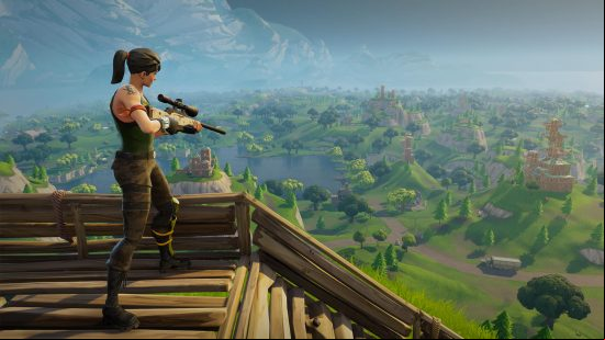 Best free PC games: Fortnite. Image shows a persons tanding with a gun on a wooden structure in the woods.