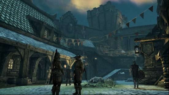 skyrim-console-commands-and-cheats-npc-commands Skyrim console commands and cheats: Guards patrol and converse on a cobbled street within Whiterun at night as festival flags flutter overhead.
