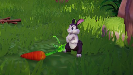 Disney Dreamlight Valley animals: A black and white rabbit sits on the ground near their favourite food, a carrot.