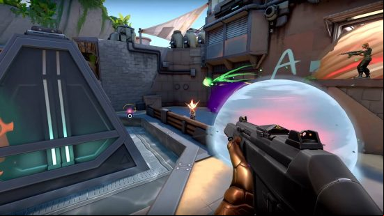 Best multiplayer games - a character aiming a gun at a rival player, with another armed ally nearby. There are several small explosions nearby.