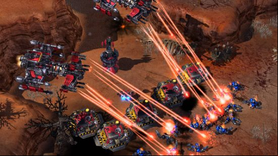 Best Strategy games - two massive airships are roasting enemies with lasers in blue in StarCraft 2.