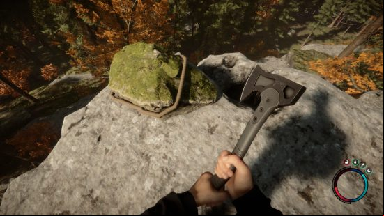 Best survival games: The player wields an axe, and is about to cut through a rope in Sons of the Forest