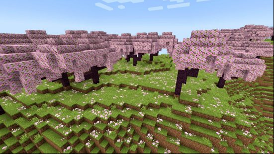 Minecraft Cherry Grove biomes: Pink Sakura trees span the horizon, with their pink petals covering green grass