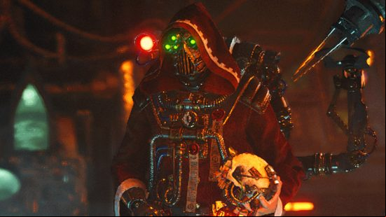 Warhammer 40k Darktide patch notes - a vendor in crimson robes with green lights on their mask