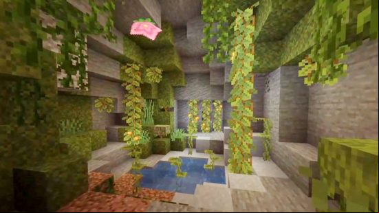 Minecraft lush caves: Lush caves are home to the Spore Blossom, a pink flower that appears on the ceiling of a small cave opening, surrounded by other lush cave plant life, like green drip leave and orange glow berries.