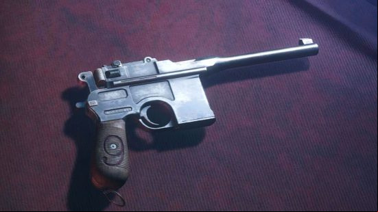 Resident Evil 4 best weapons: The Red9 handgun lying on the counter of the Merchant's shop stall.