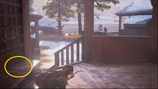 The Last of Us Firefly Pendants locations: a woman armed with a bow crouches on a porch.
