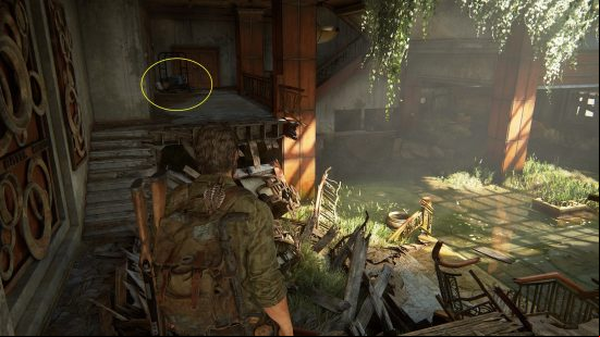 The Last of Us safe combinations guide: an older bearded man in a plaid shirt stands in a run down, half destroyed room.