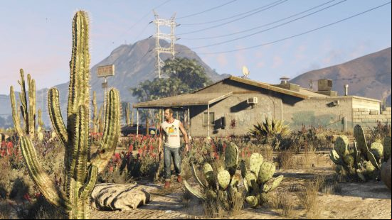 Trevor is wandering outside his house in the desert, presumably in an effort to activate some GTA 5 cheats.