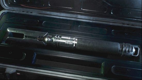 Jedi survivor lightsaber stances: Cal Kestis' lightsaber sits in a black case.