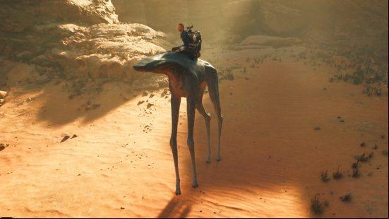 Cal Kestis rides through the desert atop a large Spamel, one of the Jedi Survivor mounts and a large creature with four very long legs.