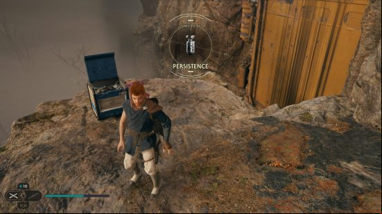 A cliffside hosts a chest with more Star Wars Jedi Survivor Lightsaber parts