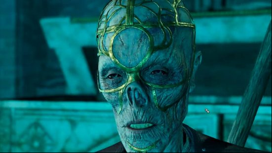 This is the Talkative Skeleton who can revive your Baldur's Gate characters. His skin is rotting and he has gold on his face.
