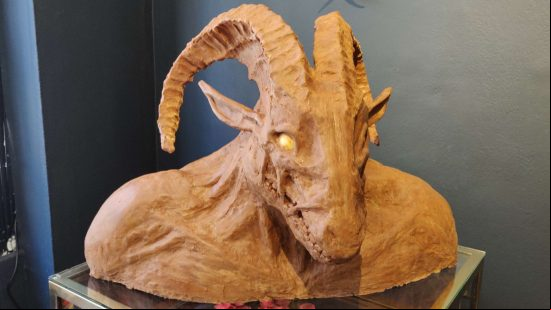Diablo 4 chocolate shop - a chocolate model of a beefy, horned Khazra goatman, left unfinished to show the modeling process.