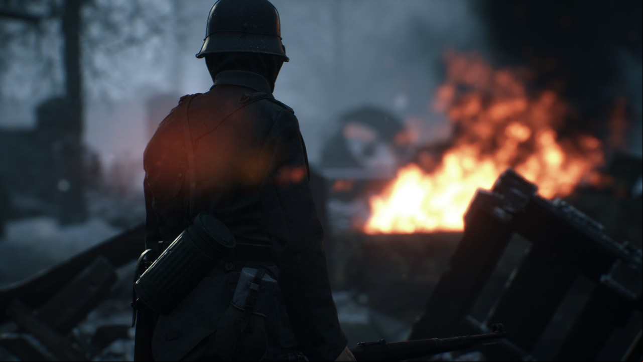 Hell Let Loose trailer apology: A German soldier stands before a burning battlefield in FPS game Hell Let Loose