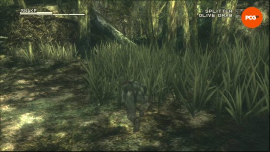 Metal Gear Solid: Snake is hiding in the grass in his camoflage suit.