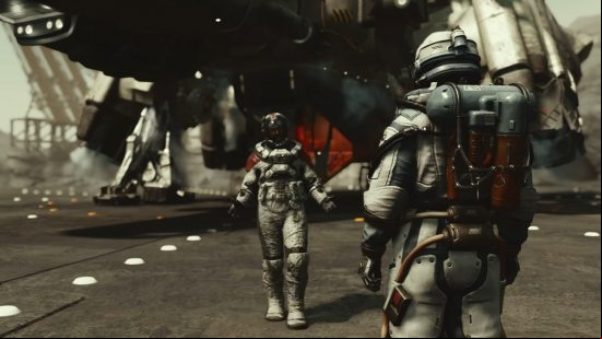 Starfield Barrett: a man wearing a spacesuit walks towards another with his arms outstretched.