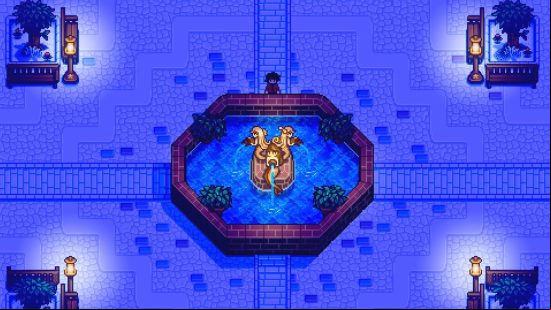 A beautiful water fountain in the centre of town at night, lit by streetlamps, in Haunted Chocolatier.