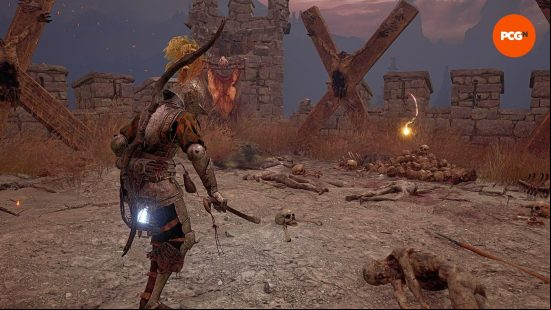 Lords of the Fallen moth mimic: The player looks at a glowing orb with a light that curves sharply, almost akin to a C-shaped formation.