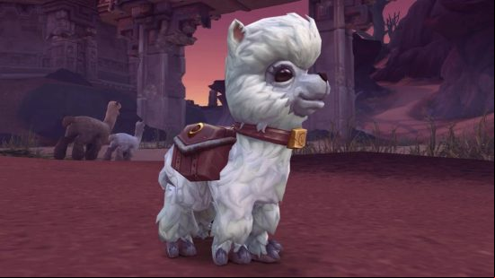 A small cartoon alpaca with white fur and a saddle bag viewed site-on wearing a collar with the World of Warcraft W on it