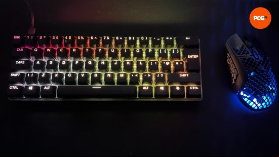 An image of the steelseries apex pro mini lit up next to the aerox 9 wireless