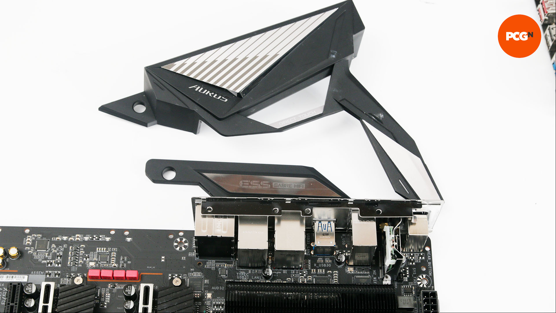 The IO shroud removed from a motherboard ready for painting