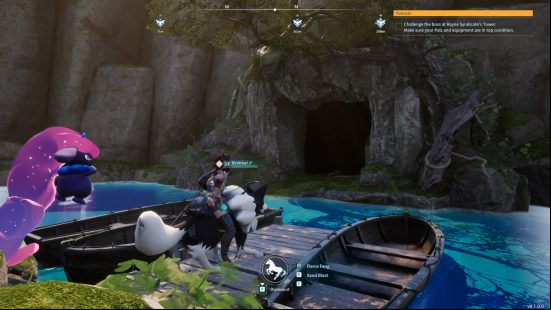 a cave entrance to a palworld dungeon near blue water