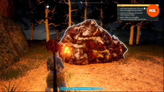 A player stands in from of a large rock, among the many Palworld resources.
