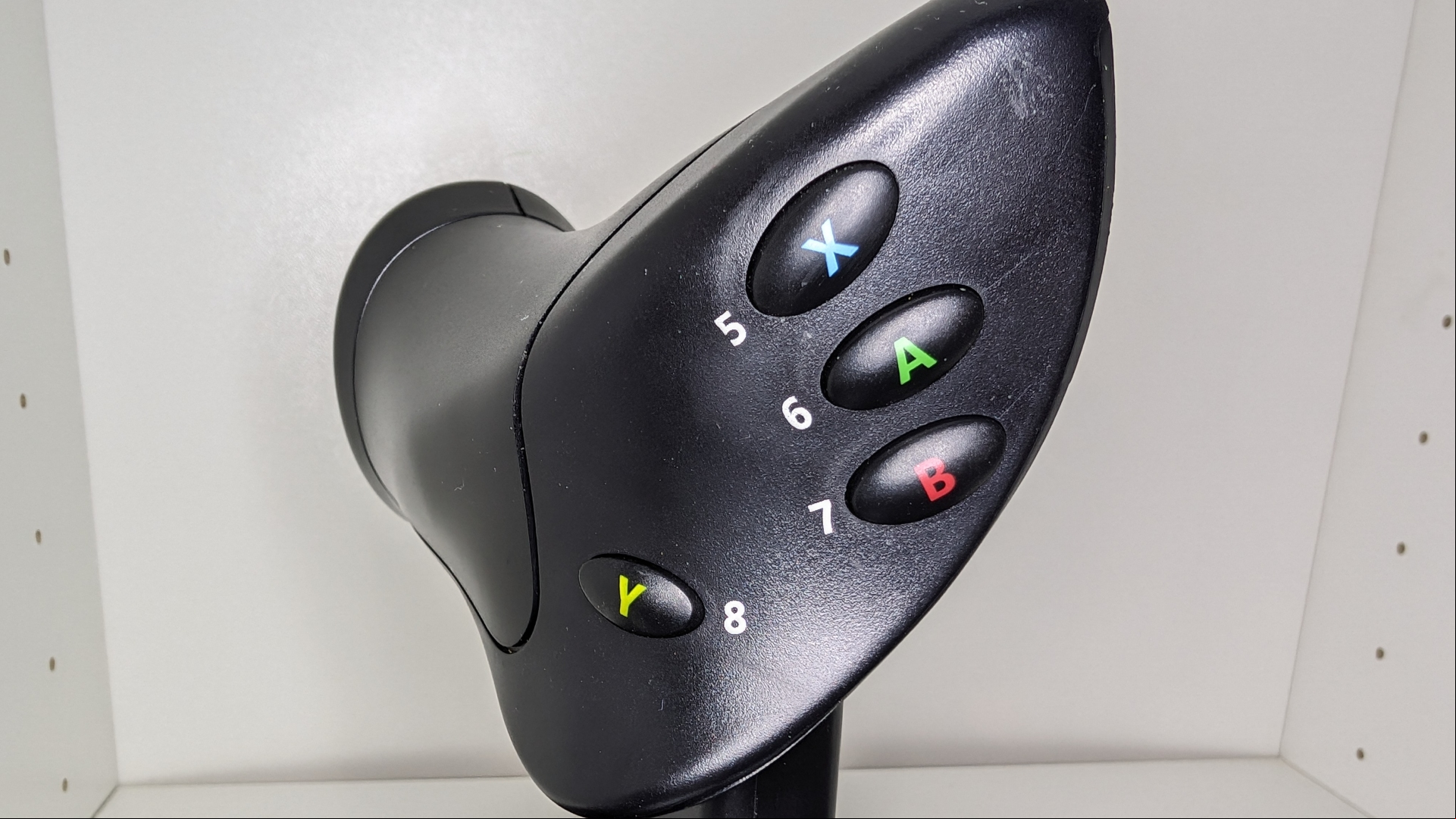 Thrustmaster HOTAS flight stick review image showing a close up of the buttons.