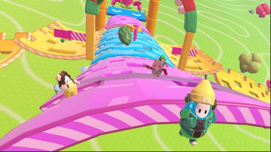 Best cross-platform games: Fall Guys. Image shows a selection of bean characters making their way through an obstacle course.