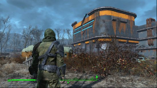 The player stands wearing green fatigues and a hood, facing a blue and orange building. 'ArcJet Systems' is written on the sign at the top of the building.