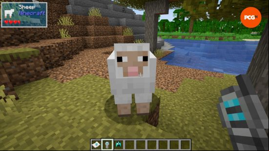 A player holding a probe looks at a sheep, a UI in the top corner shows the health state of the mob and other information thanks to one of the best Minecraft mods, The One Probe. 