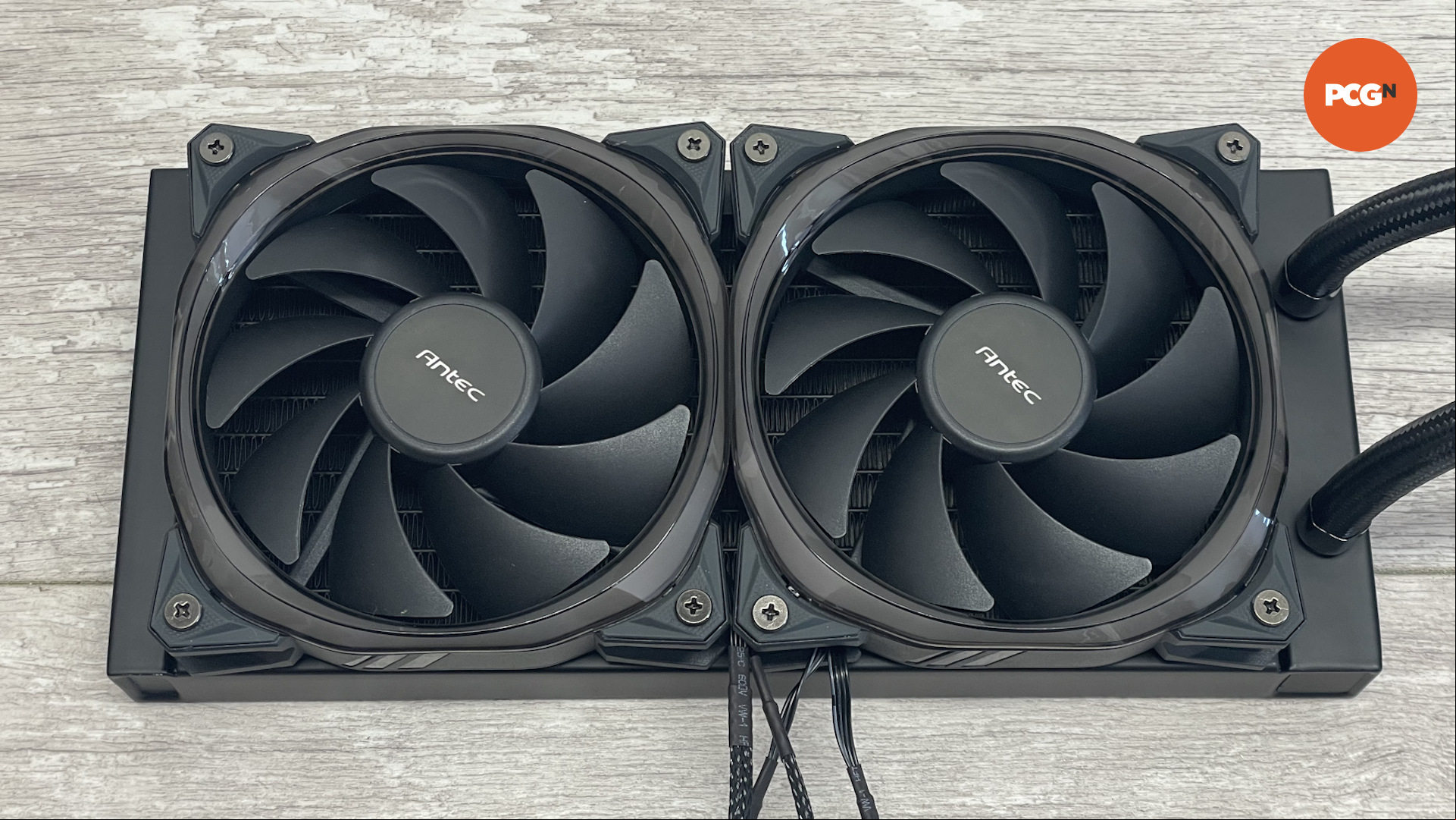 The Antec Vortex 240 AIO cooler on a wood laminate surface