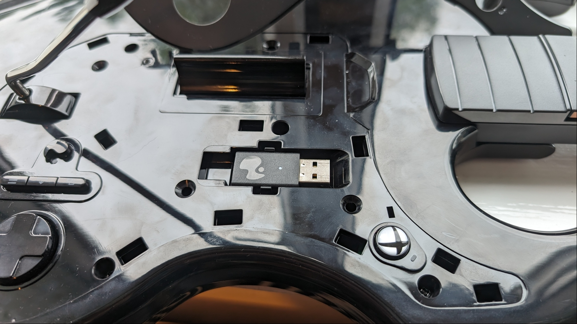 PDP Riffmaster Guitar controller review image showing its USB dongle in its compartment.