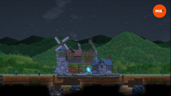 stone houses and a windmill atop a stone foundation