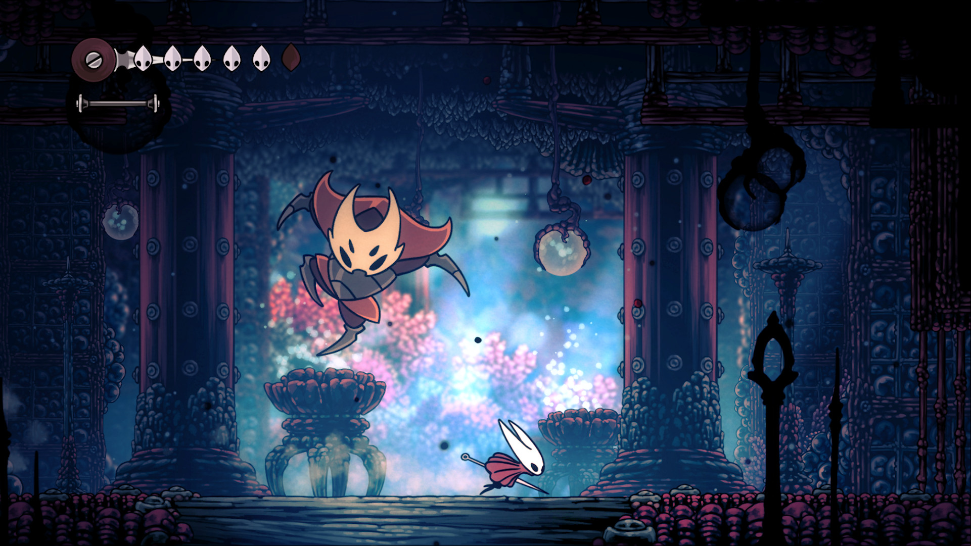 A boss battle in Hollow Knight.
