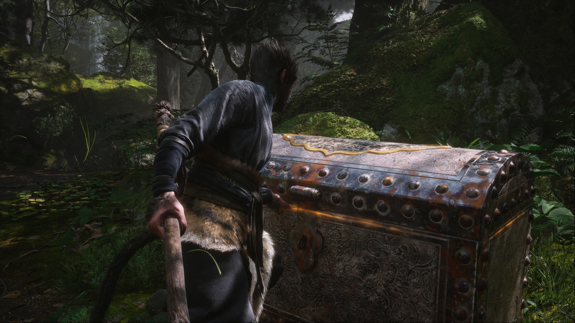 Black Myth Wukong preview: Wukong opening up a treasure chest.