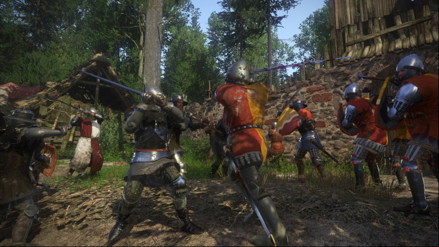 Kingdom Come Deliverance: Two knights in shining armor fight in a clearing area