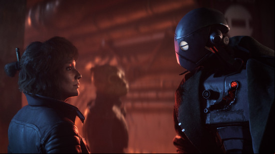 Star Wars Outlaws new game plus: a human and a robot stand facing eachother in a dark room.