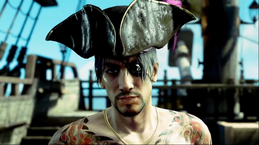 Like a Dragon Pirate Yakuza in Hawaii: Goro Majima on a pirate ship wearing a hat as he smirks towards the camera.