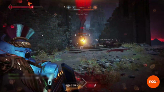 Space Marine 2 builds: A Heavy firing at an enemy player between rubble while taking damage.