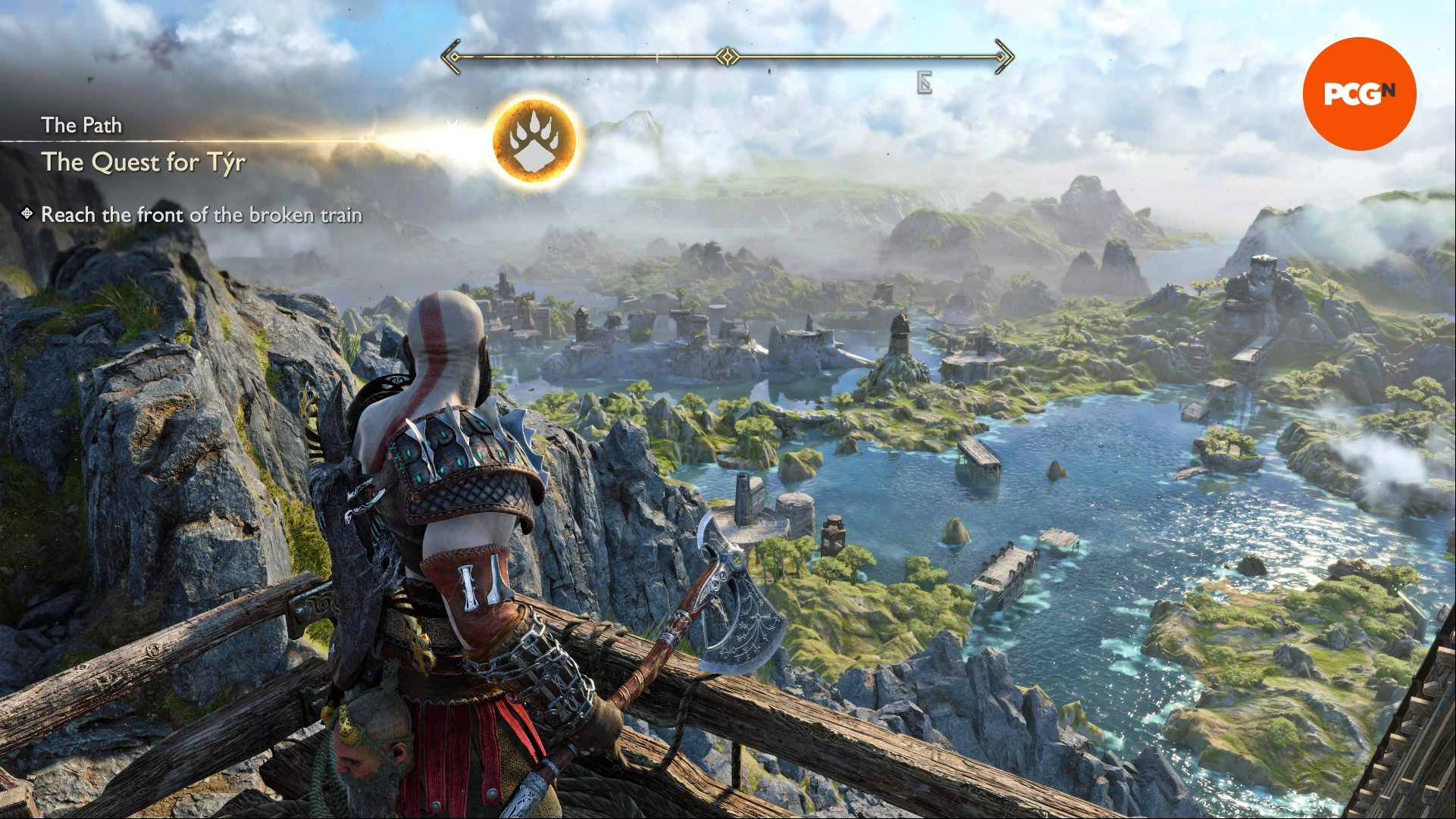 God of War Ragnarok PC impressions: Kratos looks out over the beautiful realm of Svartalfheim, characterized by lush greenery and crystal blue waterways.