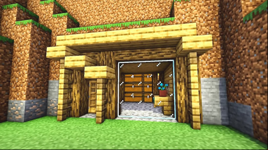 A small Minecraft house idea built inside the side of a hill.