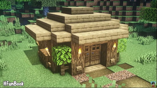 A simple rounded Minecraft house design made from oak wood.