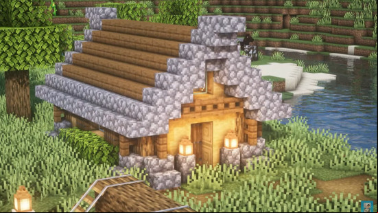 A small wooden Minecraft cottage design with a cobblestone roof.