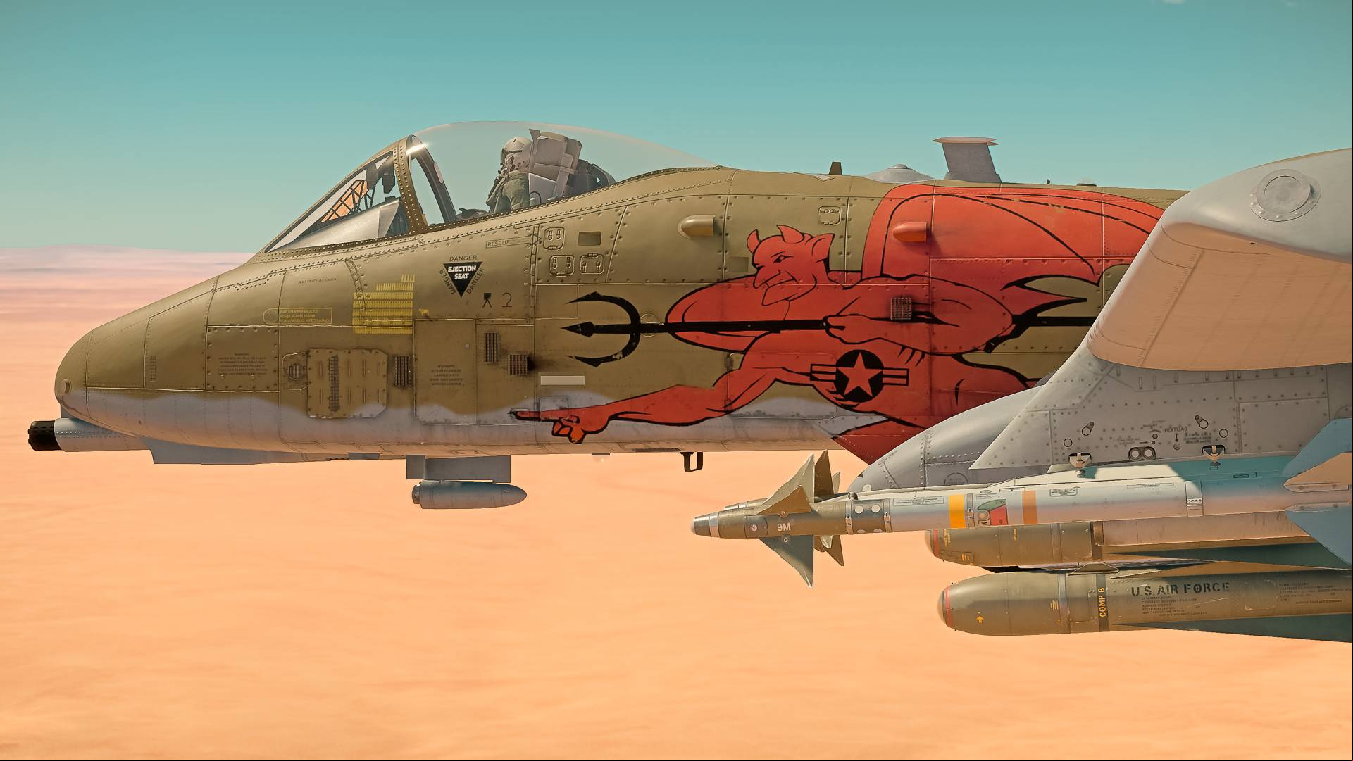A brown fighter plane with a devil on the side flies through a desert area