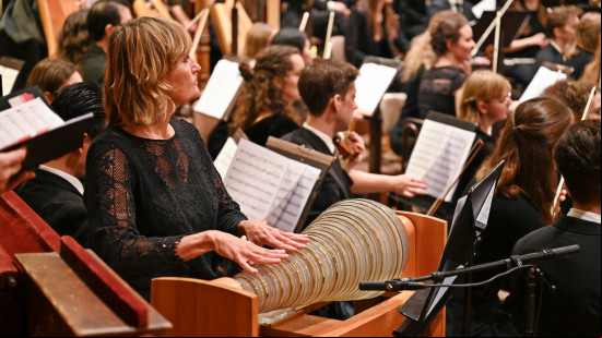 Christa Schönfeldinger looks attentively towards Vijay Upadhyaya for her cue to begin her solo on glass harmonica as part of the Impact4Music: Diversity in Harmony benefit concert.