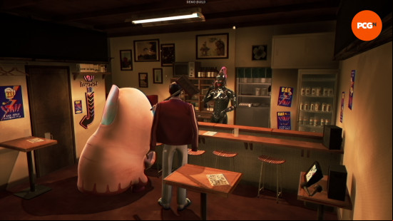 A giant thumb and a man in a red jacket and tan slacks stand in a bar, the bartender wears a black latex outfit